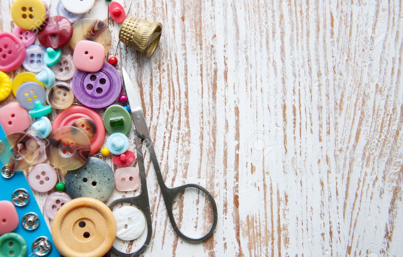 Sewing-stuff-on-a-old-wood-background-Stock-Photo-sewing-craft-buttons